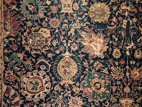 Antique Persian Area Rugs: A Tapestry of History and Art A vibrant Persian area rug with swirling floral designs, capturing Safavid artistry. Photo by Kadir Celep