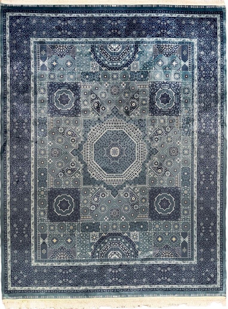 Do Persian Rugs Need Pads? A Blue Silk Persian Rug Horizon 8 x 10 with intricate patterns, perfect for a large Persian rug setup on wood floors. Credit: Afra Rugs.