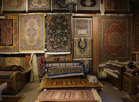 Do Persian Style Rugs Shed? Let’s Find Out! A vibrant display of intricate Persian rugs fills a store, showcasing a rich tapestry of patterns and colors. Photo by Zahide Taş