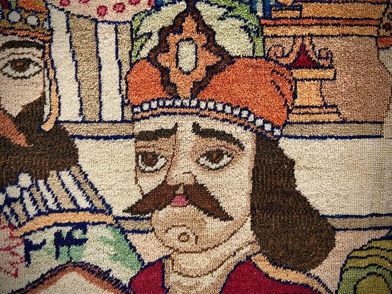  A segment of a rug featuring a detailed figural motif