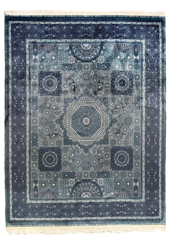 Rug vs Carpet: Why a Persian Style Rug Wins A blue large Persian rug from Afra Rugs’ Modern Rugs Collection