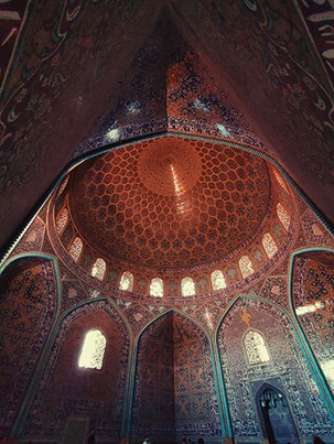 Isfahan Rugs: A Timeless Persian Art An awe-inspiring view of the intricate dome and stunning tilework inside a mosque in Isfahan City, Iran. Photo by sina drakhshani