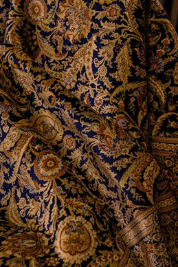 Elegant Black Persian Rugs: History and Style A symphony of black and gold, this elegant rug brings timeless beauty and warmth to any space. Photo by Paolo Bici
