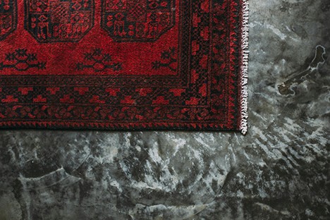A close-up view of a wool Persian rug reveals its robust construction and characteristic patterns, demonstrating its enduring quality and aesthetic versatility. Photo by Rachel Claire
