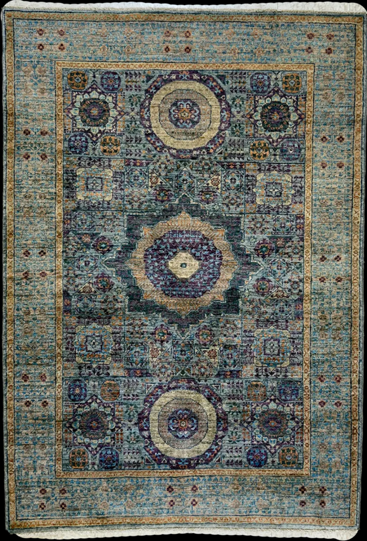 A stunning silk Persian rug with a low pile, showcasing the intricate Tabriz design in gray and purple tones.